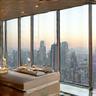 Floor-to-ceiling windows with panoramic city views
